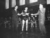 Team Receives Medals: Captain Badger Martin receives individual medals for the Champion Team. Left to right: Coach Joe Vachon, Badger Martin and Johnathan Lowe. (Source: Concord Training School Treasure Chest, 1951.)