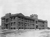 Campus View, 1912:  The Administration Building, the first building to occupy the new 26.4-acre campus, shown here soon after its construction was completed in Spring of 1912.