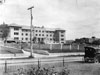 Campus View, 1921:  The new residence hall for women (McComas Hall), the second building added to the new campus, shown here under construction in 1921 prior to first being occupied on April 4, 1922.