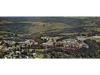 Campus View, Mid 1960s:  Panoramic view of the campus with its next group of additions completed over the period 1956-1963, including Callaghan Stadium (1956), College Courts (1958-1962), Wilson Hall (1962), Wooddell Hall (1962), and the College Center (1963).   Closer views are shown in the next two slides.